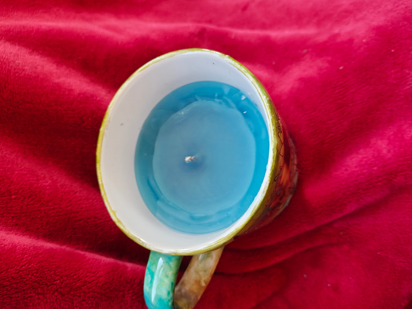 16oz ceramic coffee mug with blue candle