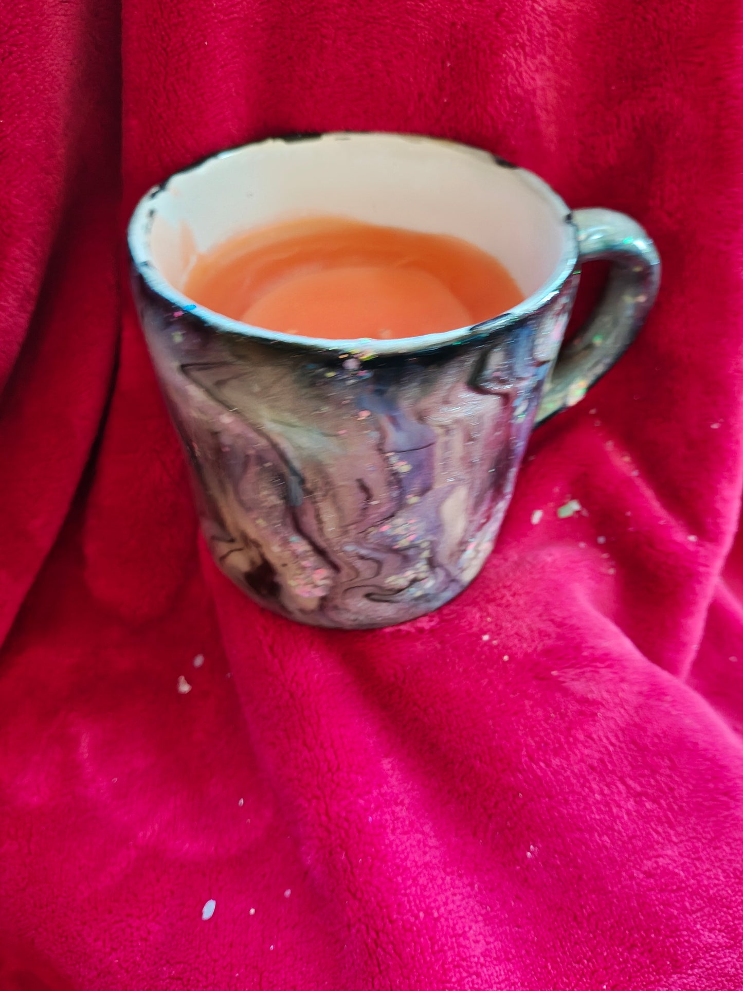 16oz ceramic coffee mug with orange candle