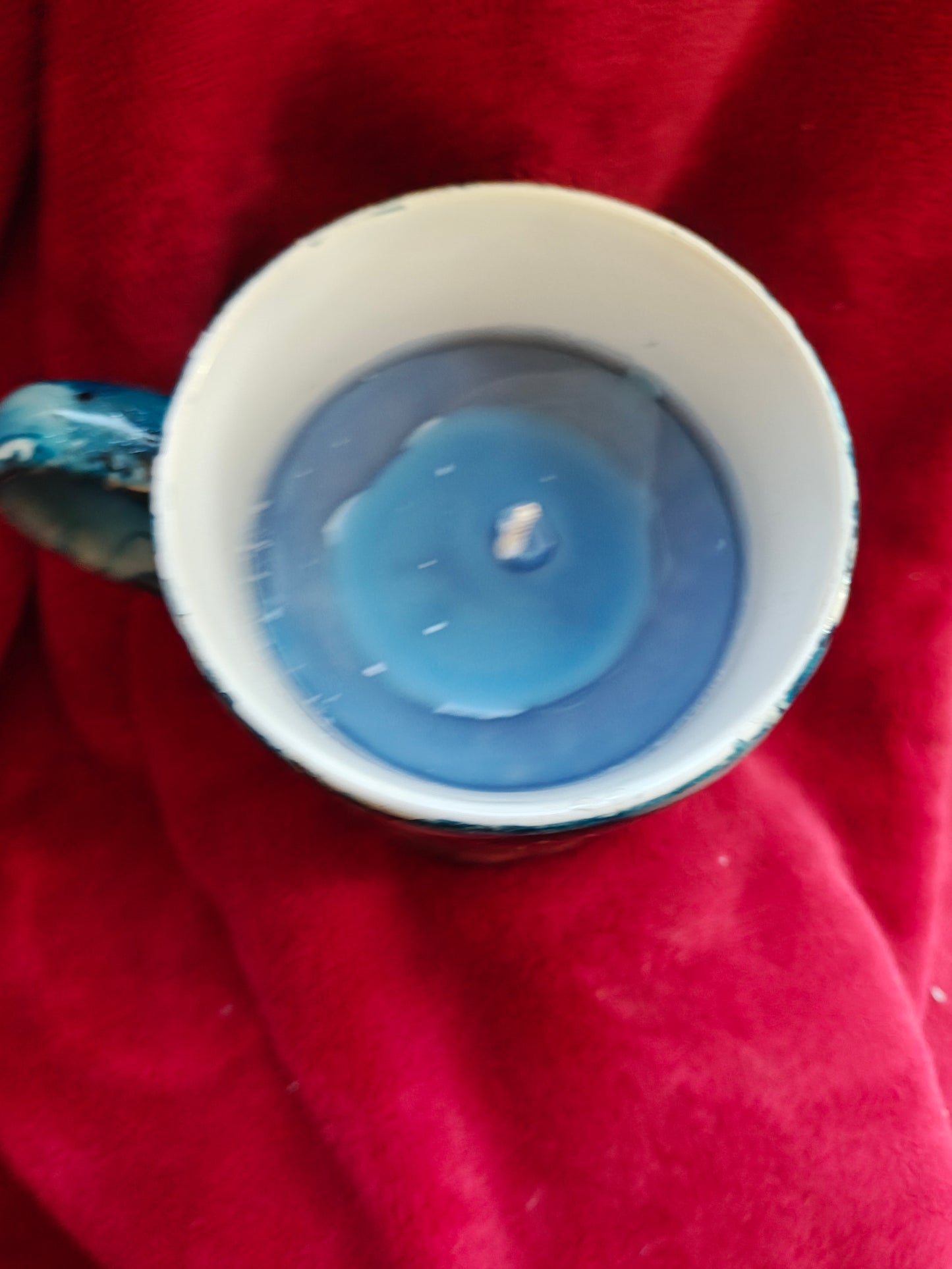 16oz ceramic coffee mug with blue candle