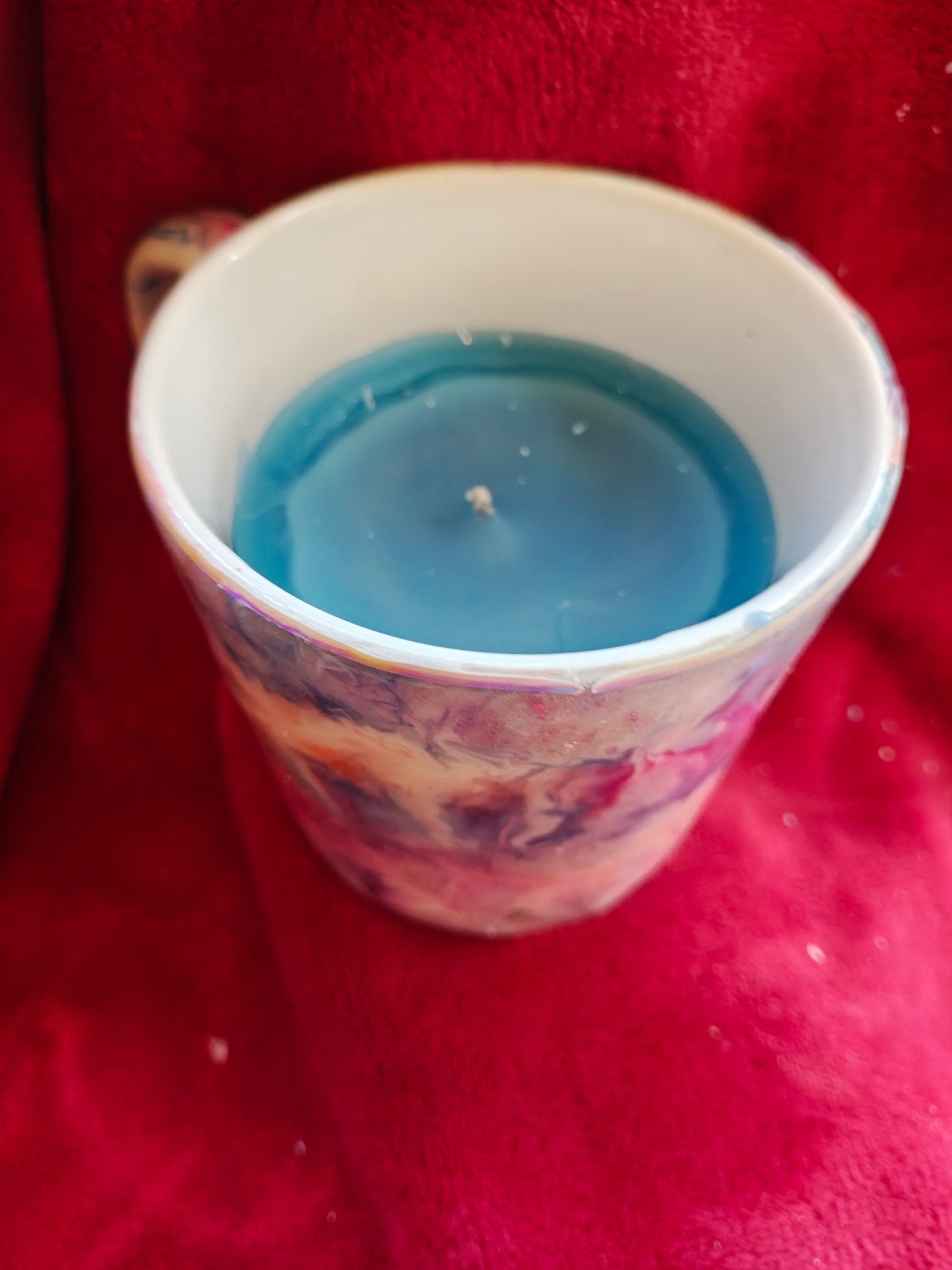 16oz ceramic coffee mug with blue candle