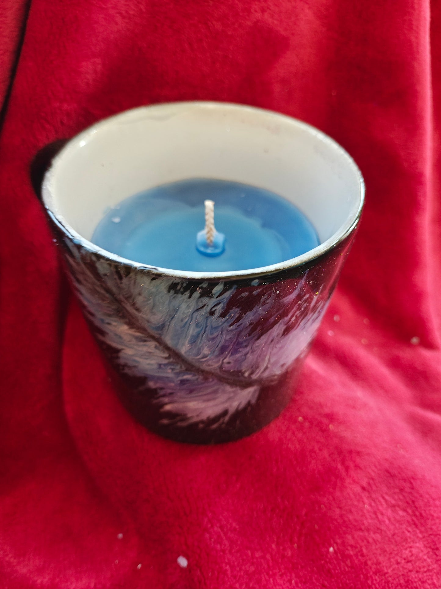 16oz ceramic coffee mug with blue candle