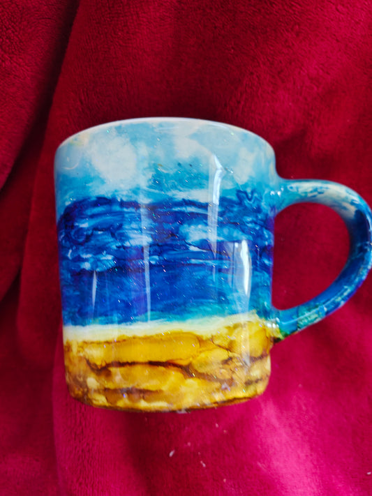 16oz ceramic coffee mug with blue candle
